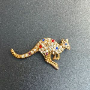 Gold toned and rhinestone studded kangaroo brooch